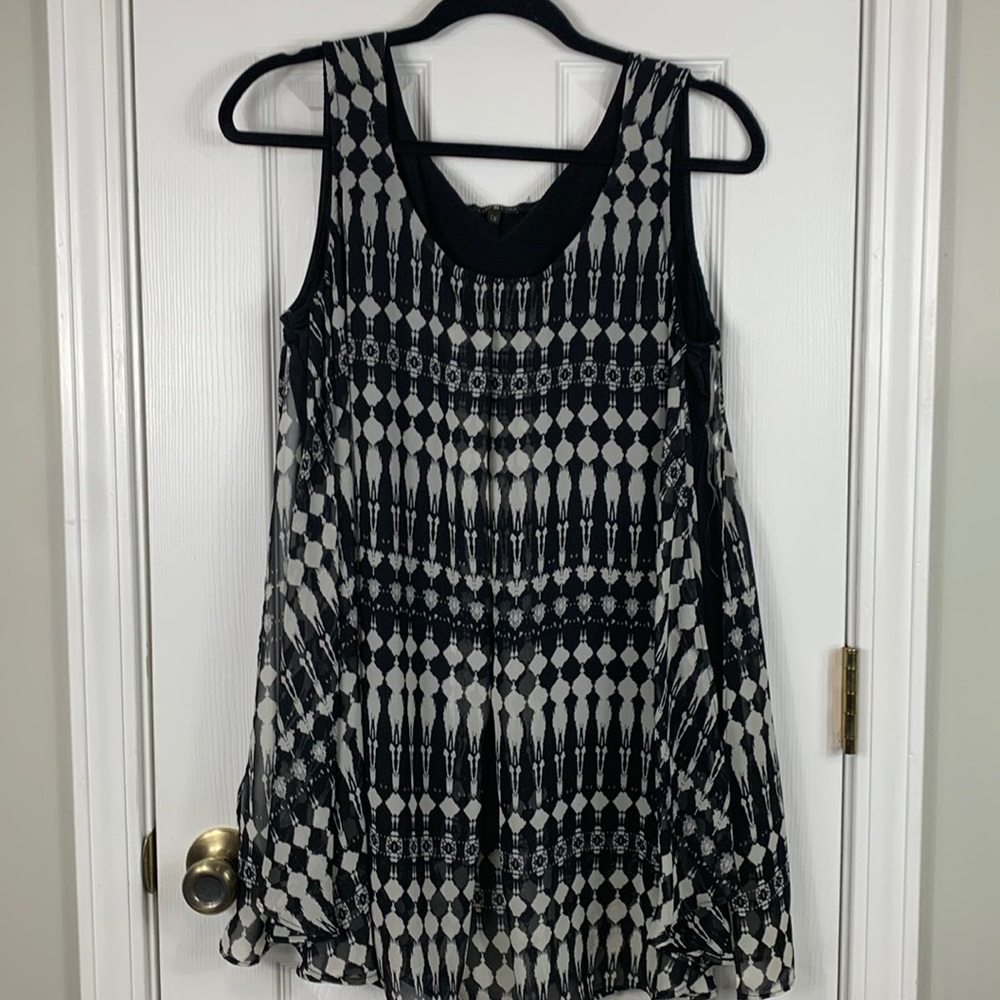 Time Line black and white sleeveless top size 1X. Top layer sheer with openings